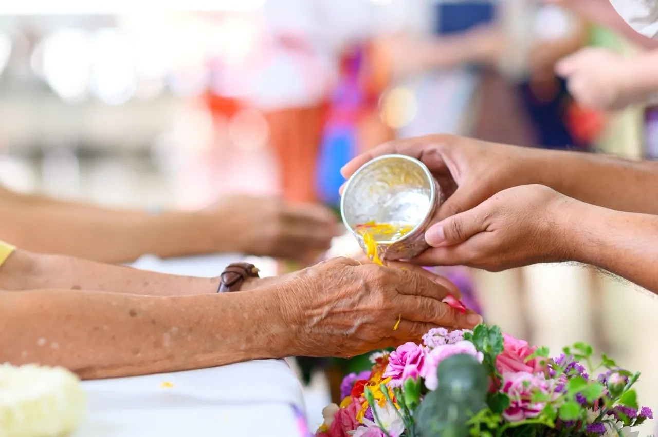 One of the traditions during Songkran festival is where younger family members gently pour scented water over the hands of their elders
