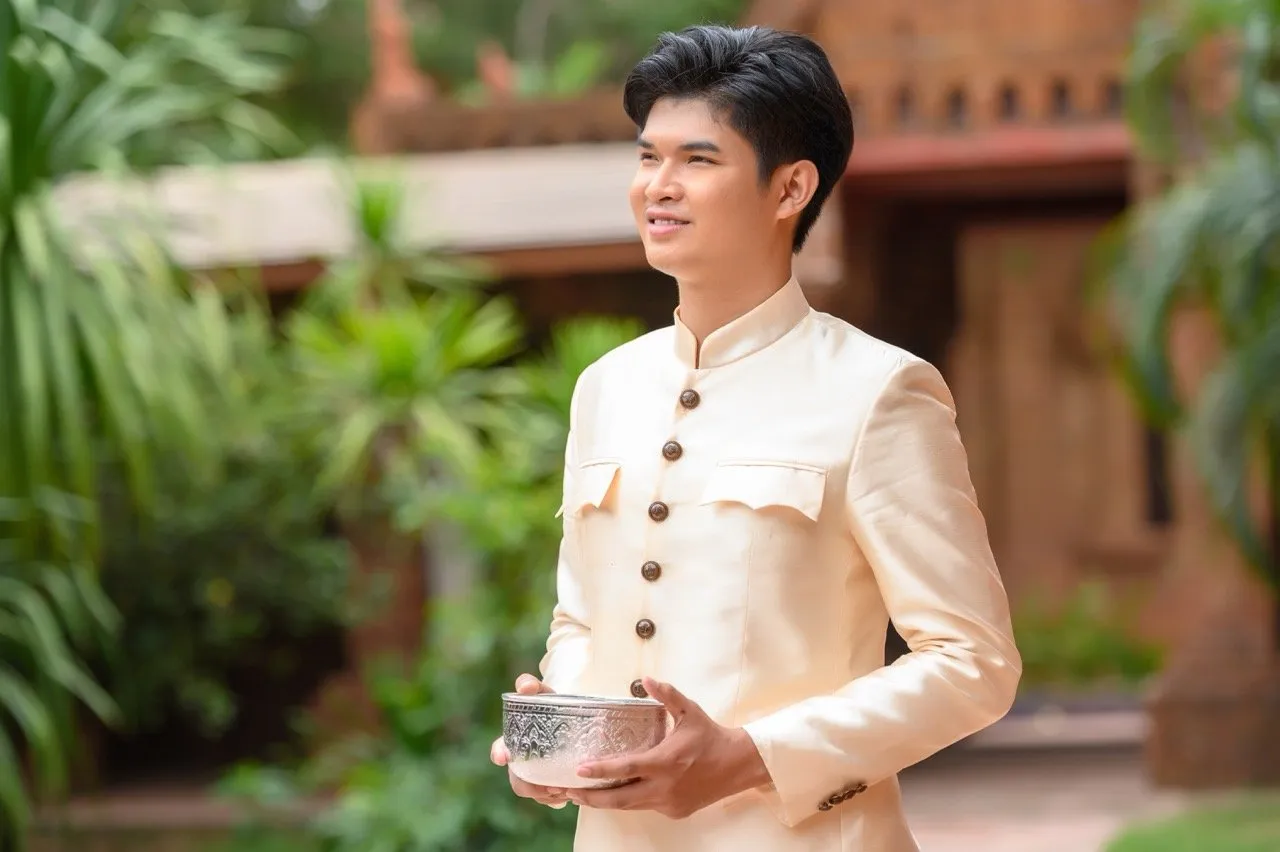 A man in a traditional Thai outfit