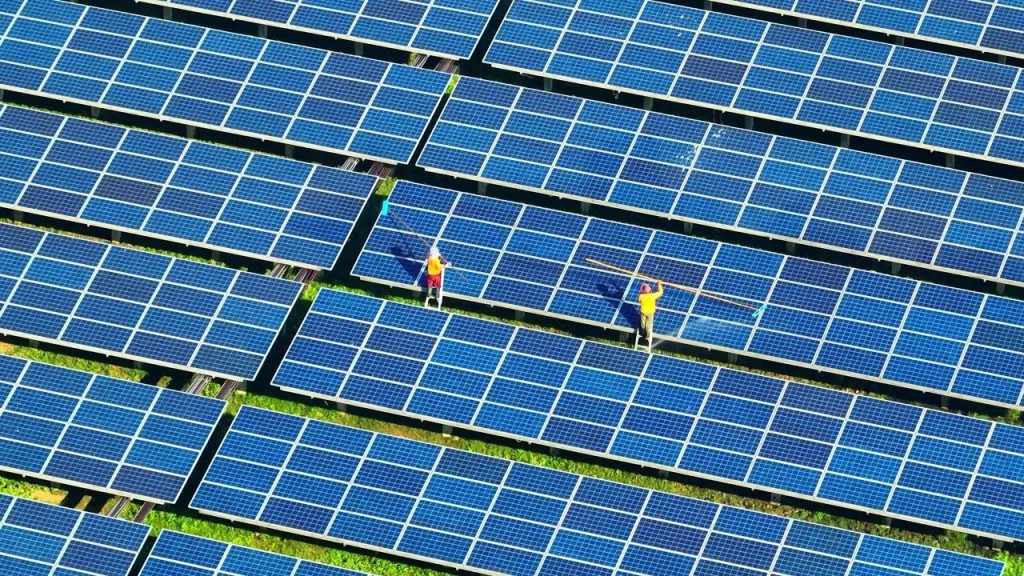 Workers maintaining the solar panels