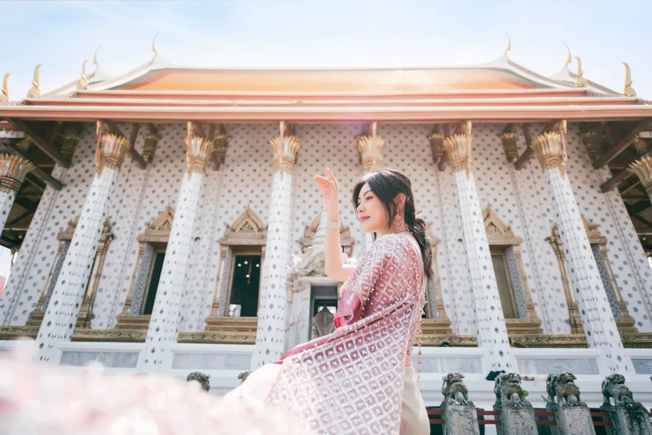 A woman wearing a traditional Thai outfit