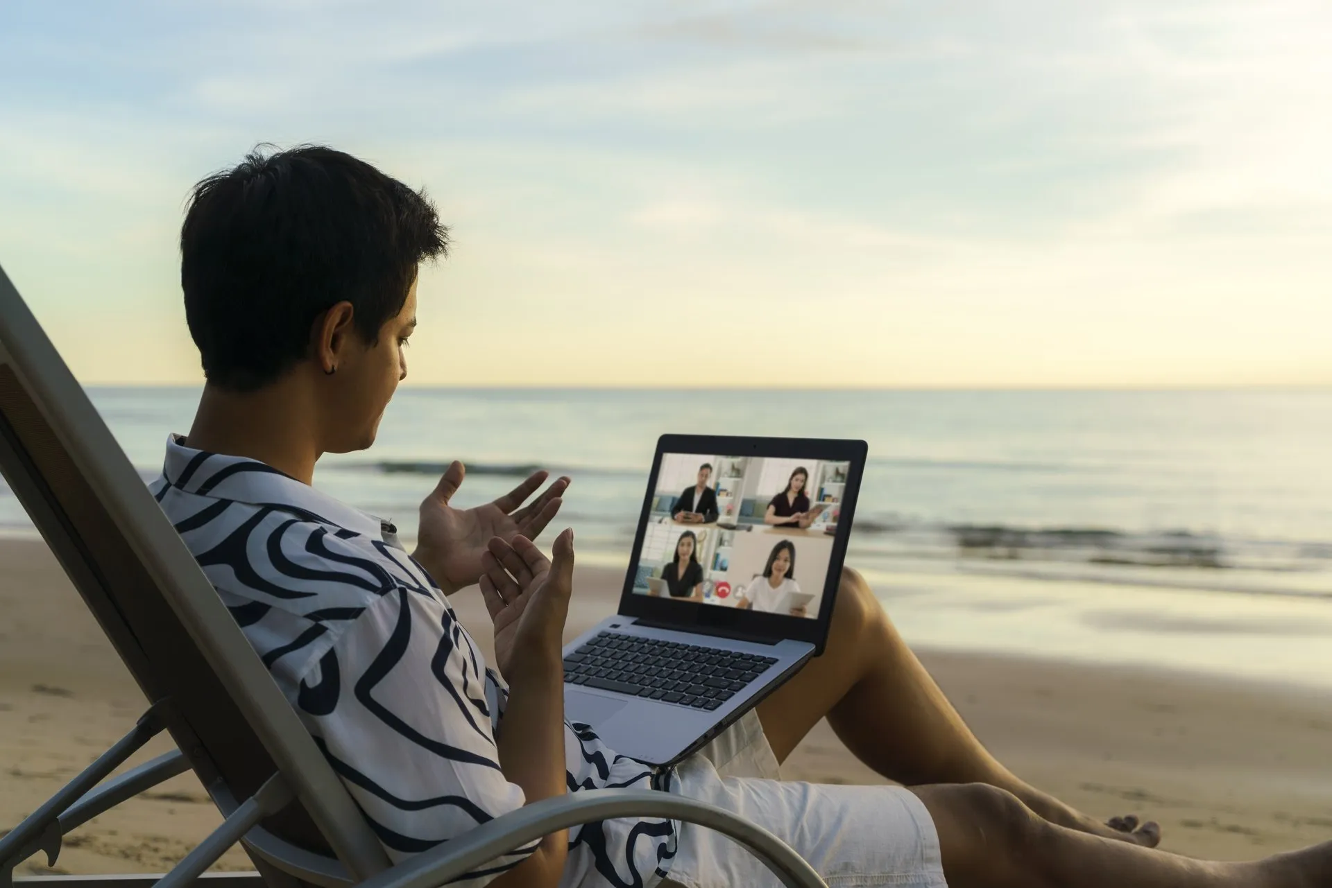 A person working remote from the beach