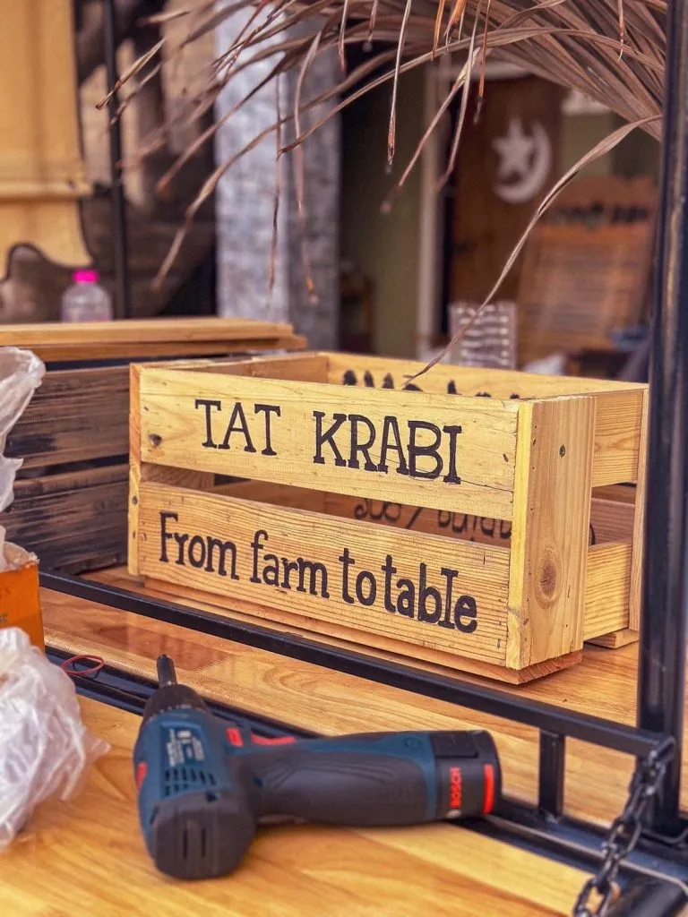 Milk crate that says "TAT KRABI from farm to table"