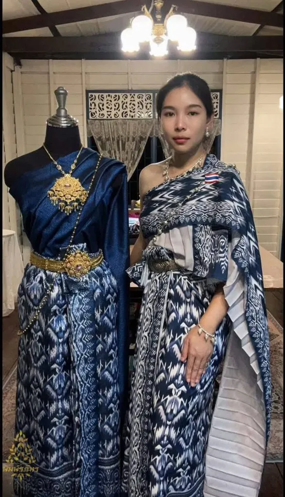 Surin-based Thai fashion designer posing in traditional Thai dress made with Mudmee silk in an original "Mae Yanang Gripen" pattern.