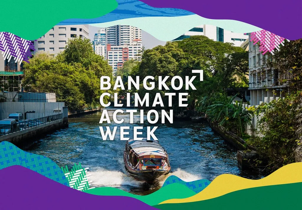 A ferry traveling down the river in Bangkok withe the text overlay of Bangkok Climate Action Week.