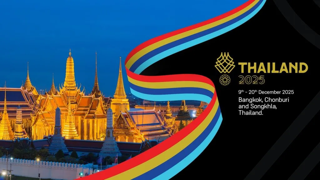 Landscape of Thai temples at night with 4-color ribbon dividing the between the temple and a black screen with a few lines of text.