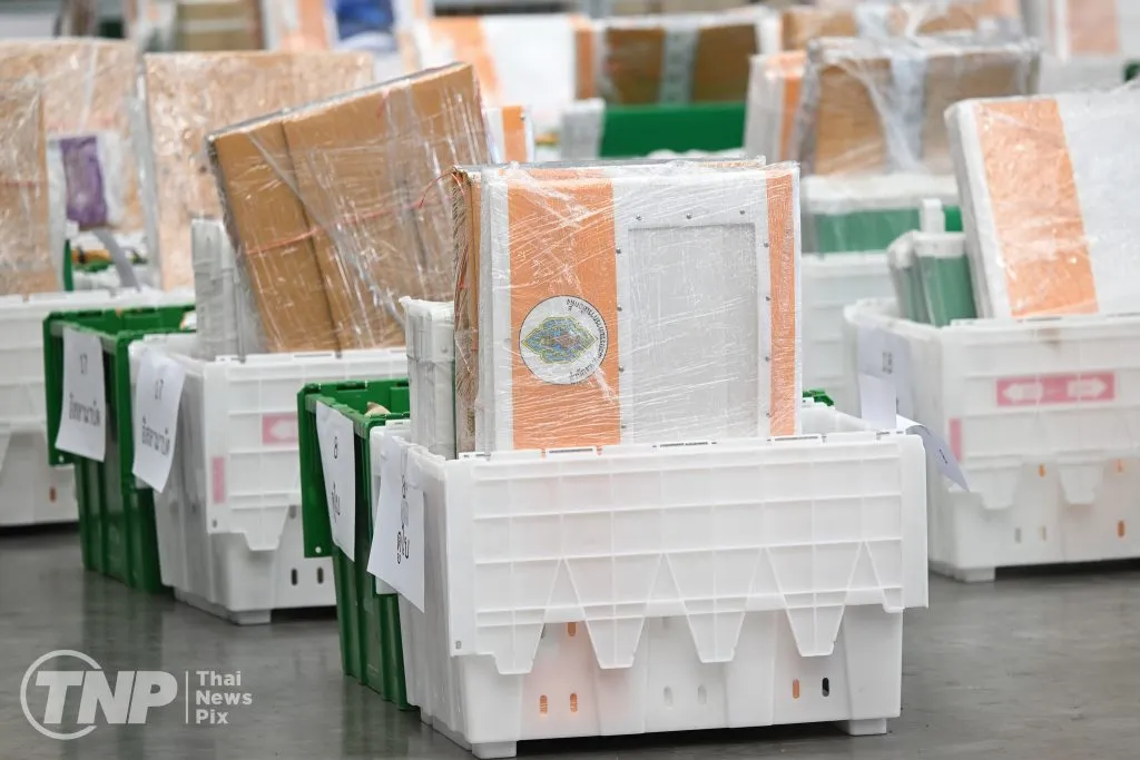 ballot packages for overseas voters wrapped in plastic sheet sitting on the floor.