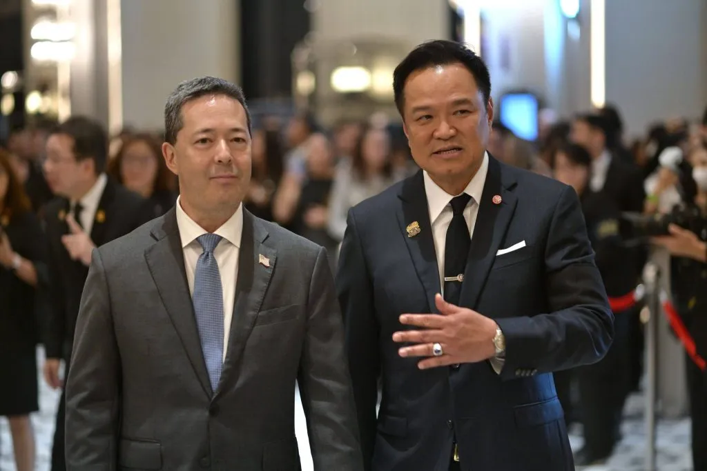 U.S. Ambassador Sean O'Neill and Prime Minister Anutin Charnvirakul walk together while conversing warmly.
