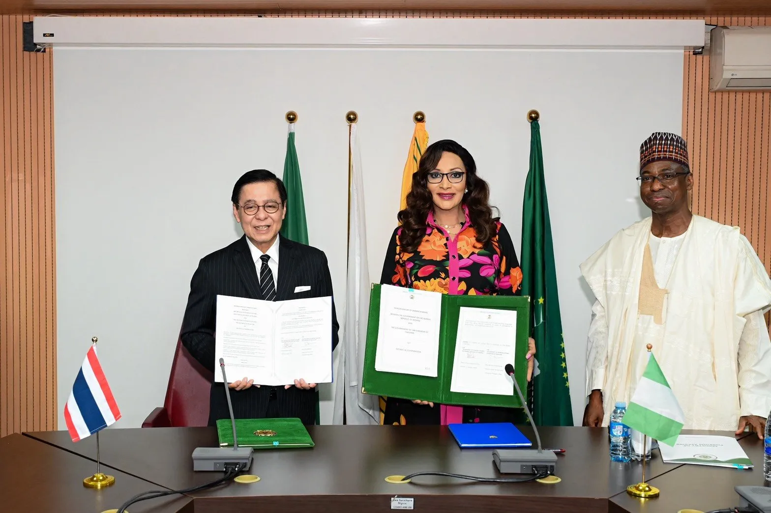 Thailand and Nigeria officials display signed technical cooperation documents during bilateral talks in Abuja.
