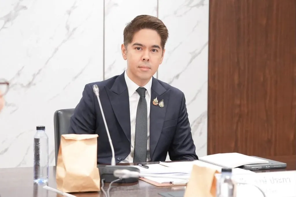 Thai Trade Representative Werapong Prapha sits at a conference table with documents during an official meeting.