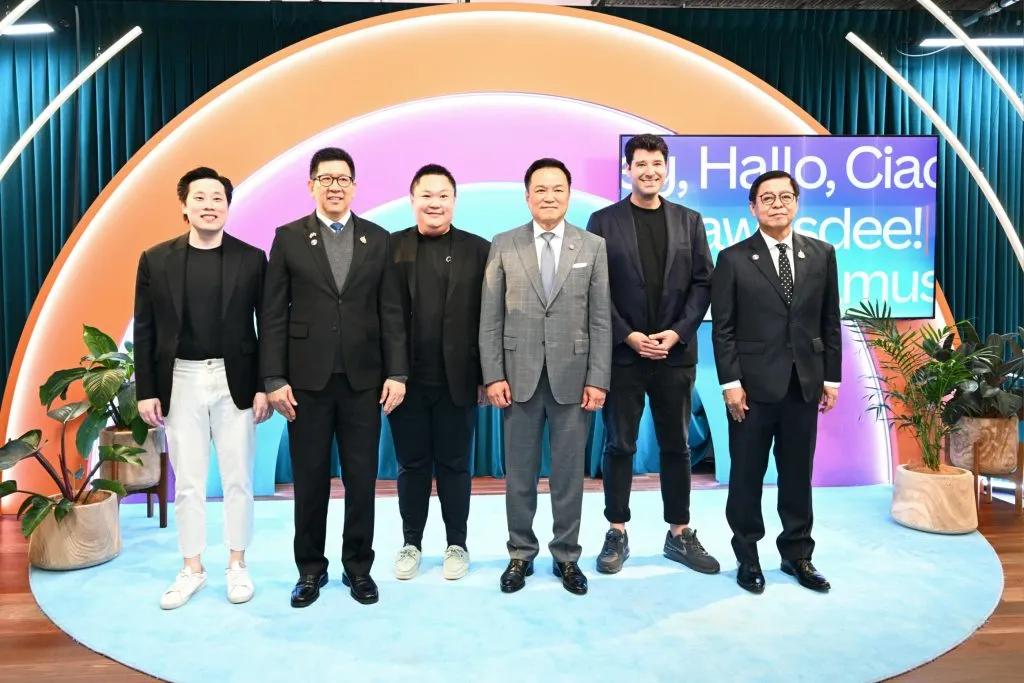 Thai prime minister poses with Canva executives and officials inside the company's colorful Sydney headquarters.