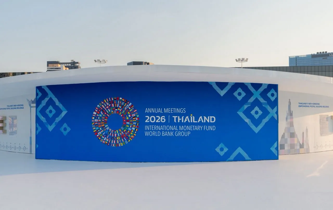 A banner promoting the AM2026 Thailand event near QNSCC.