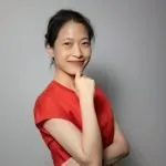 Dr. Nittaya Phanuphak wearing red top, smiling.