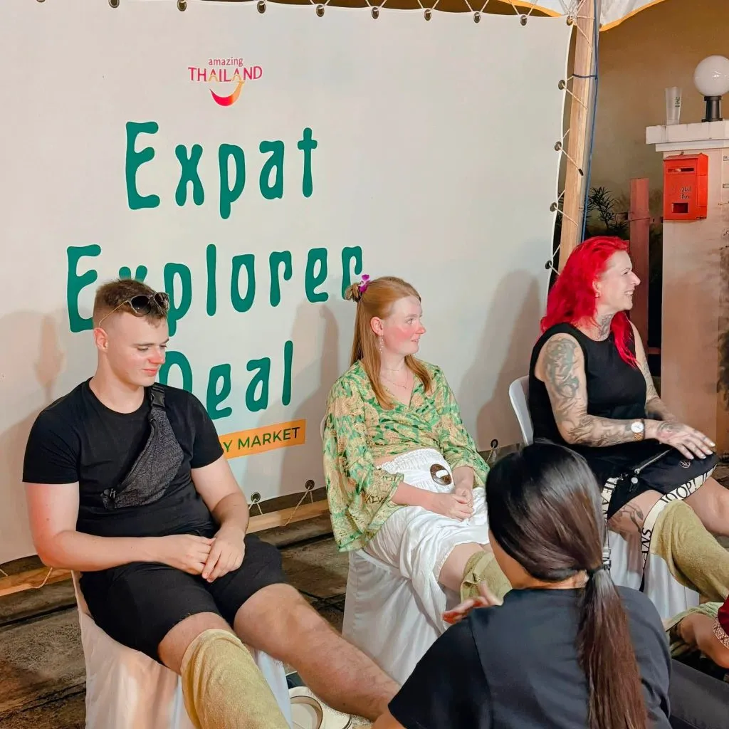 3 Individuals getting Foot massage.
